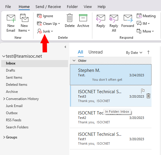 A screenshot of the Outlook mailbox with an arrow pointing to the Junk option.