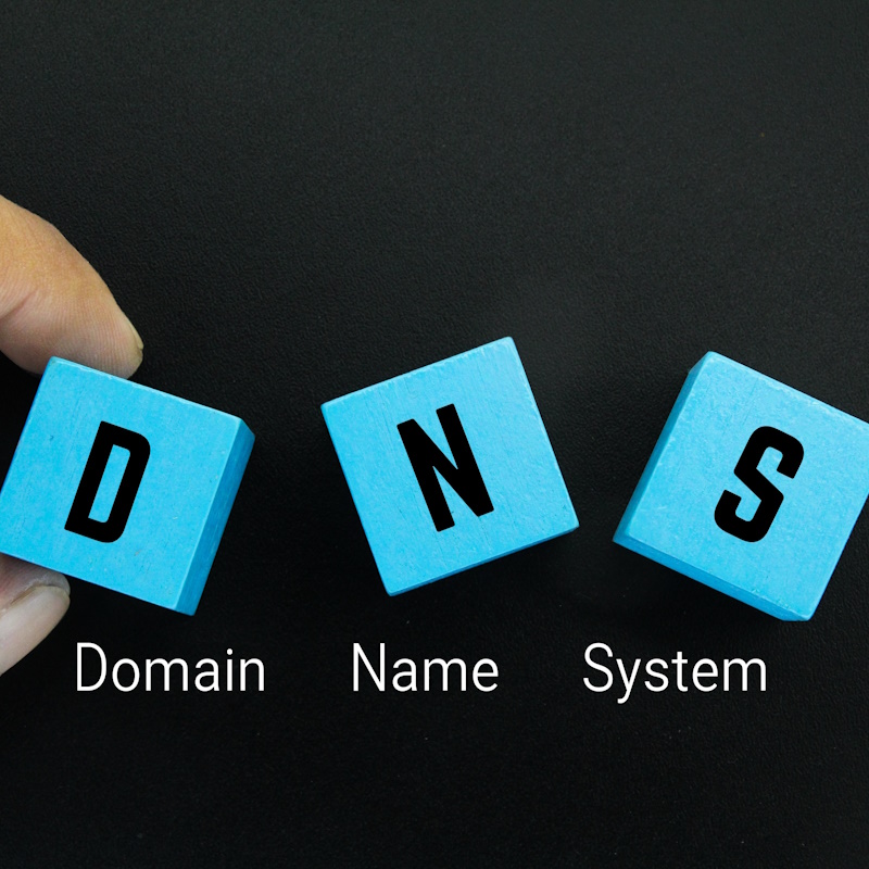 An image with 3 blocks showing the letters D N S, representing Domain Name System.