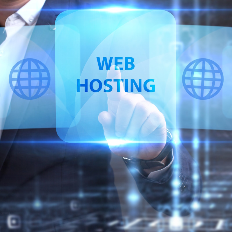 A man touching a blue lit screen that reads "Web Hosting" with other faint blue screens behind it on either side displaying a grided globe.