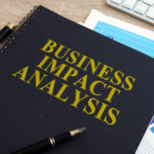 An image of a black notebook that reads "business impact analysis".