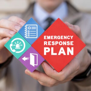 I image of a man holding 4 blocks, 3 with images that represent with the fourth blocks reads, "emergency response plan".