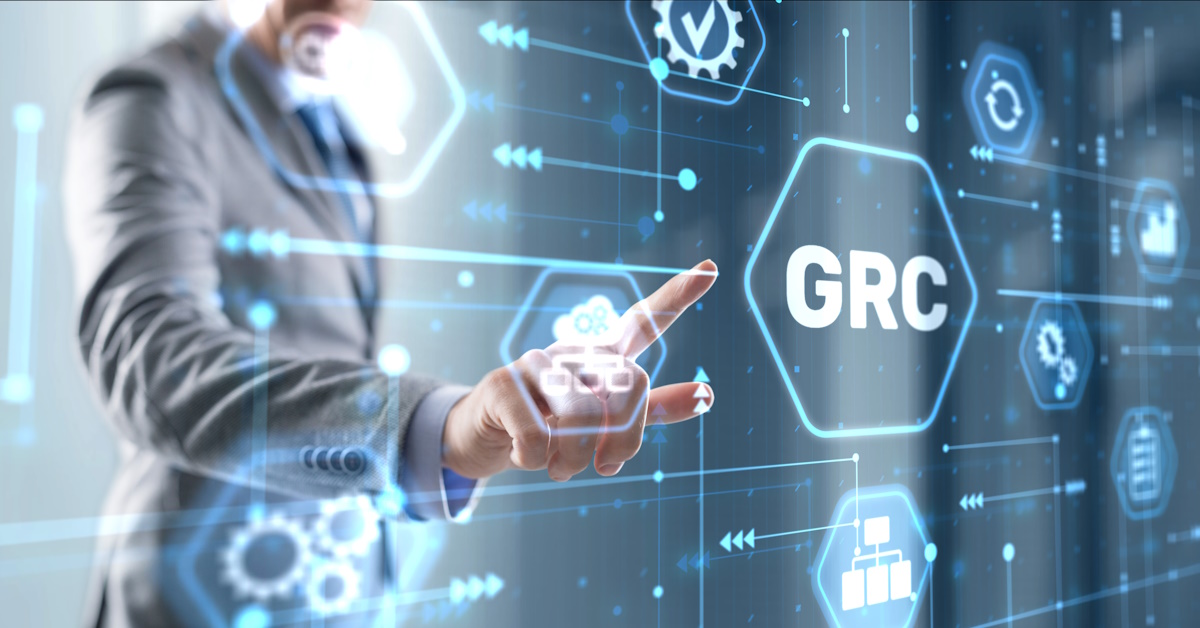 Image of a man interacting with a holographic screen that has icons representing GRC.