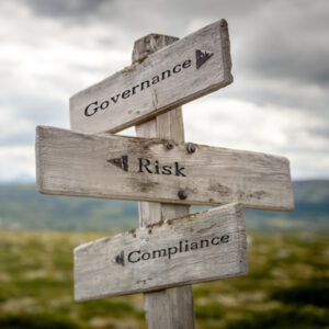An image of a road sign reading "governance, risk, and compliance".