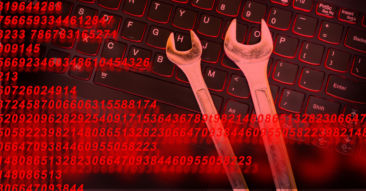 An image with numbers spanning across the foreground, and two wrenches laying on top of a laptop keyboard.