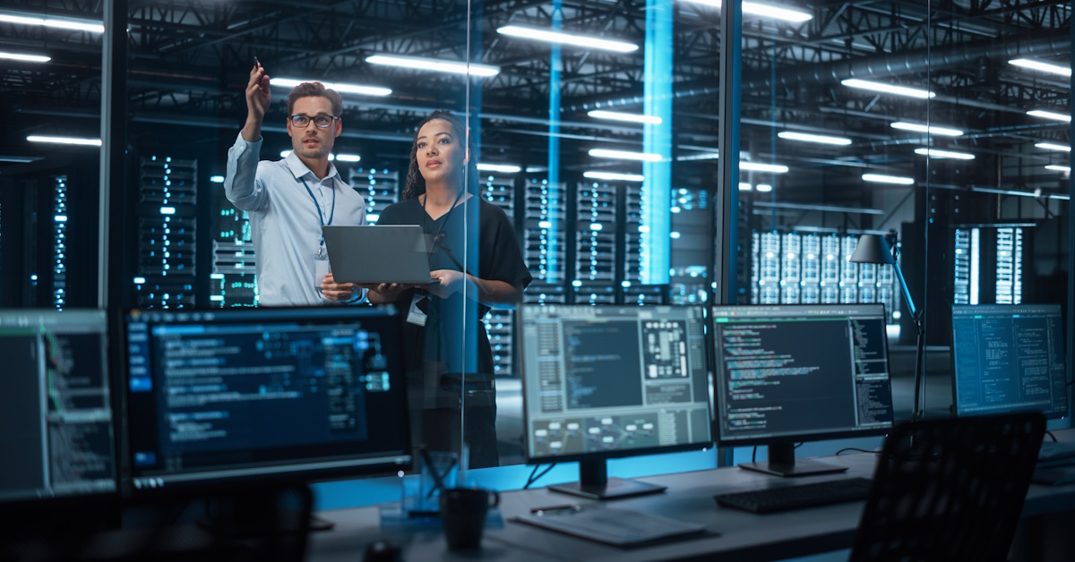An image of two cyber security experts going over best practices.