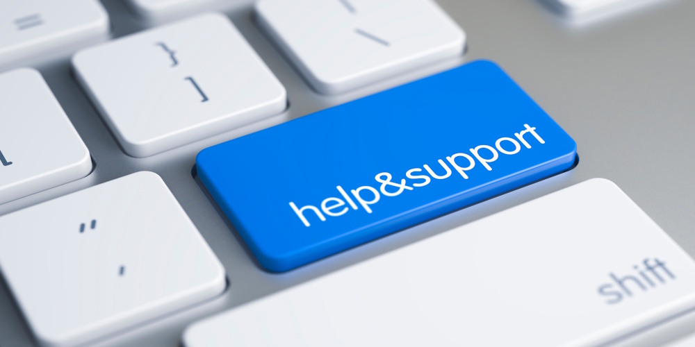 White keyboard keys, there is one key that is blue and says "help&support".