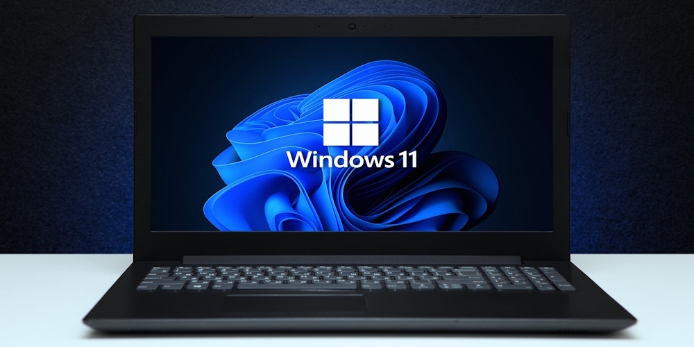 Black laptop with Windows 11 loaded on the screen.