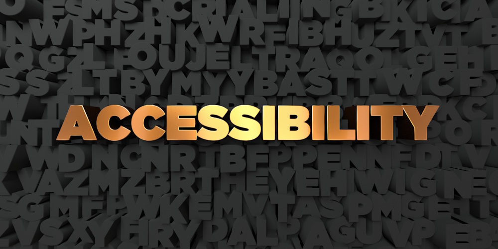 An image of jumbled black letters and in the center the word Accessibility is lit up in golden letters