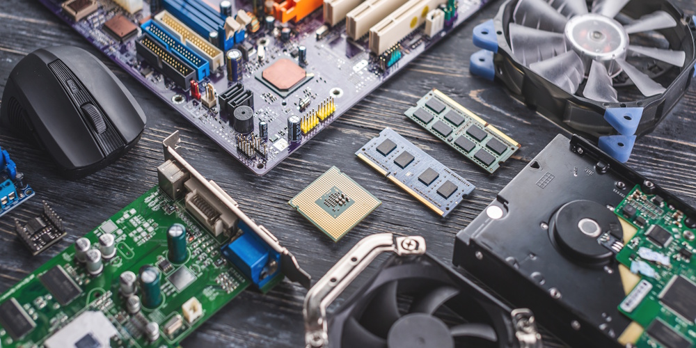 Computer hardware is being shown, there is a mouse, CPU, Ram, Storage, fans, hard drive, and a motherboard.