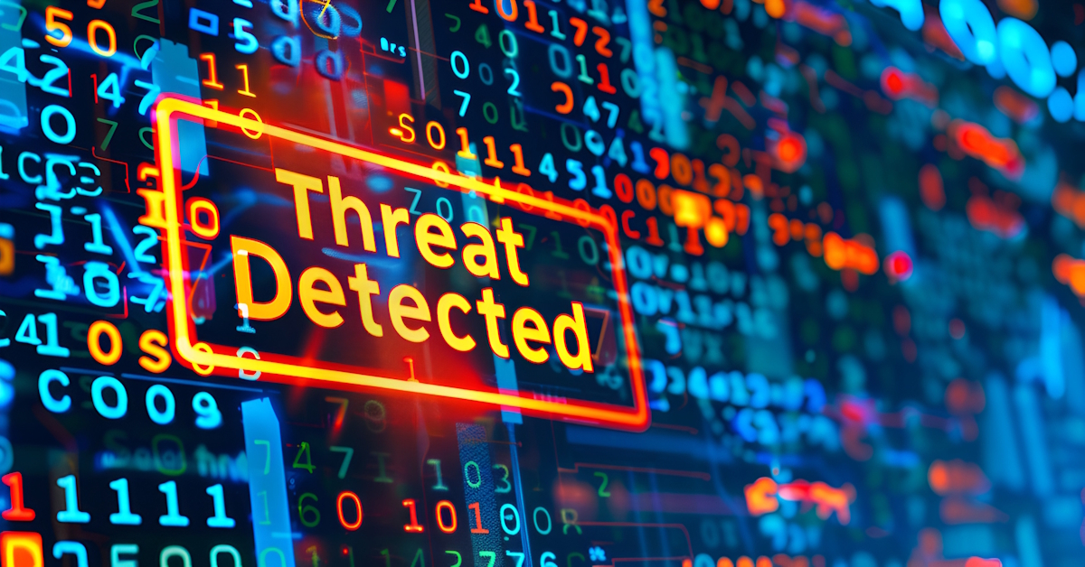 A digital screen displays the warning message "Threat Detected" over a background of colorful, random numbers and code, representing a cybersecurity threat alert.