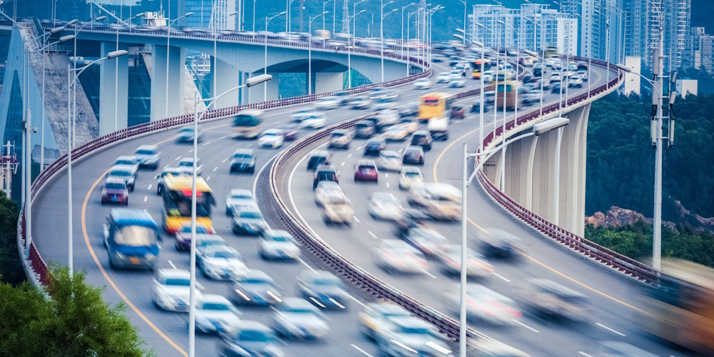 An image of an interstate with heavy traffic.