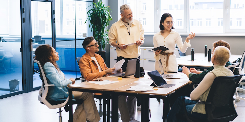 An image of several experts meeting in a conference room.